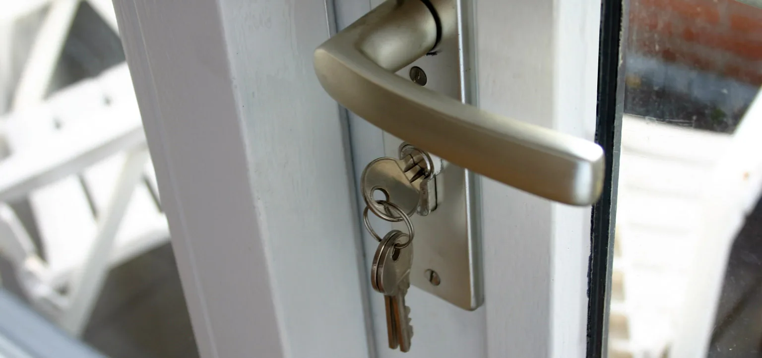 Keys in the lock of a residential entry door