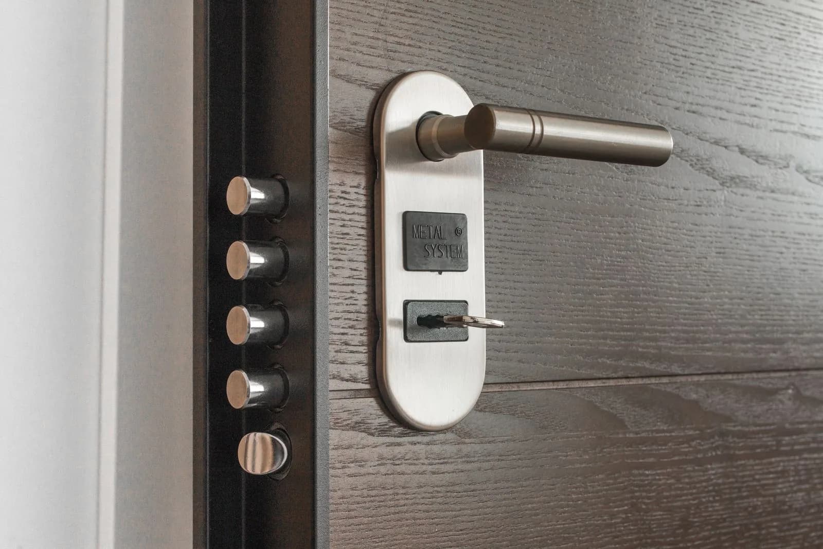 A commercial lever handle and multi-point lock on a business door