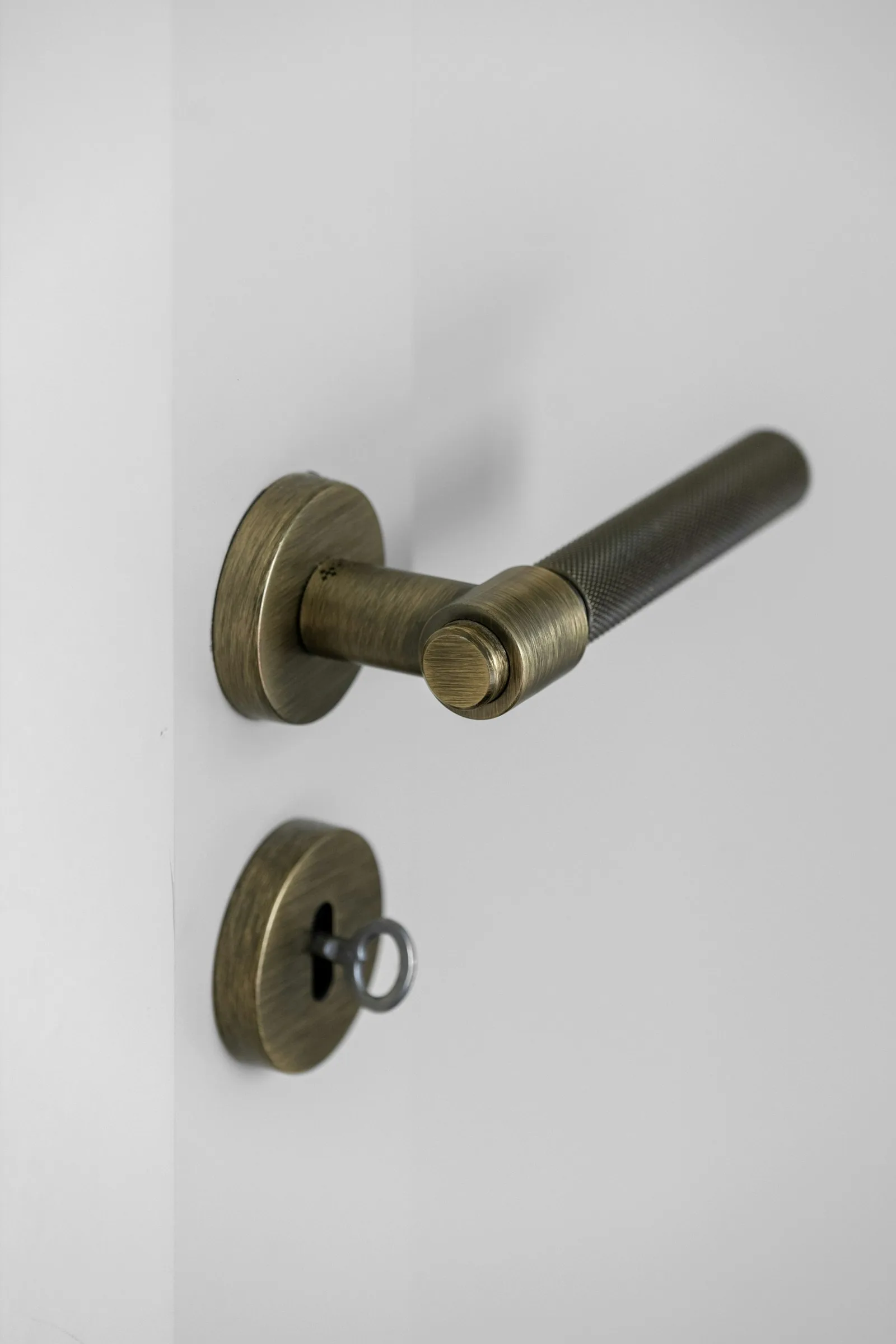 An antique-brass decorative lever handleset
