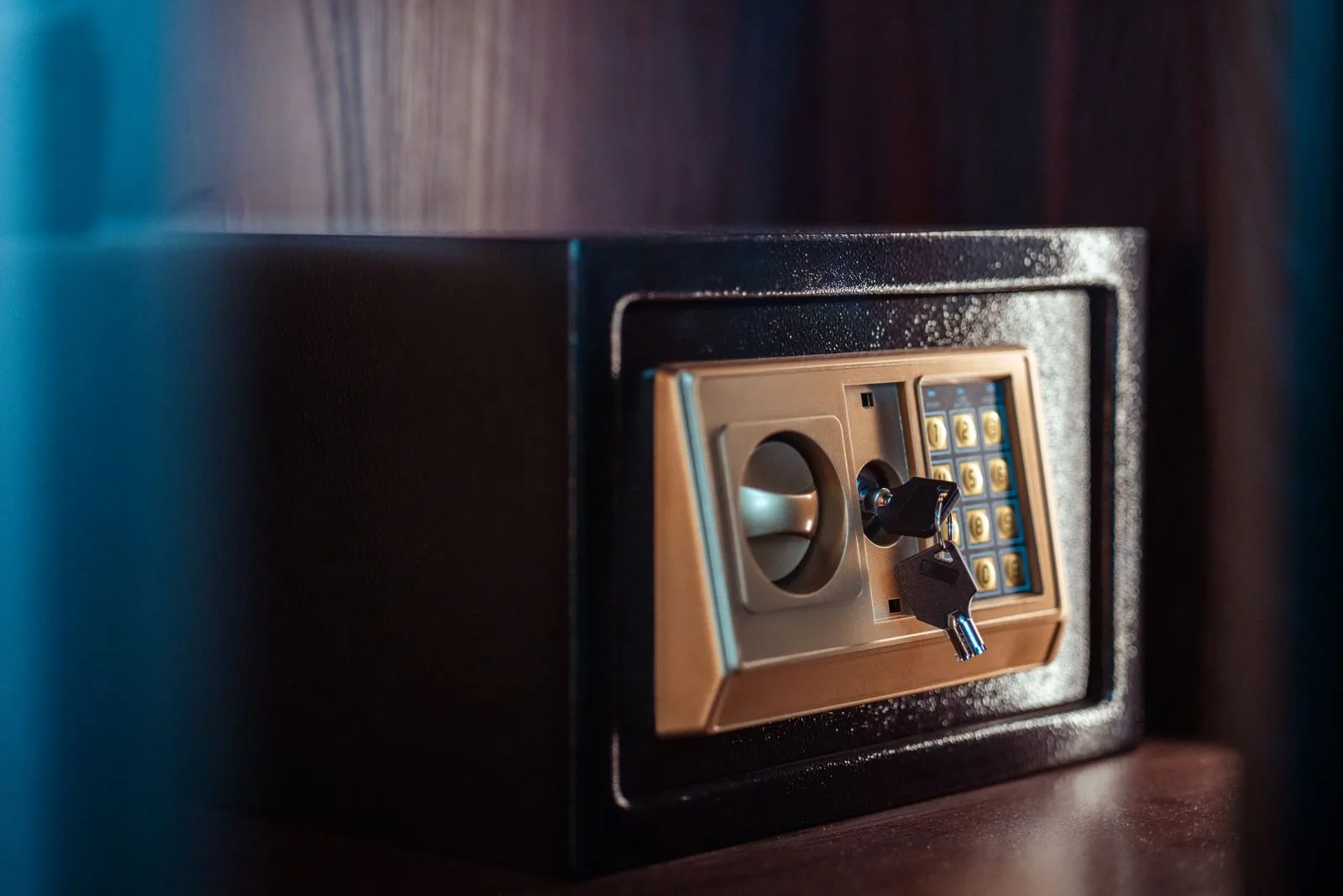 A modern home safe with an electronic keypad and key lock